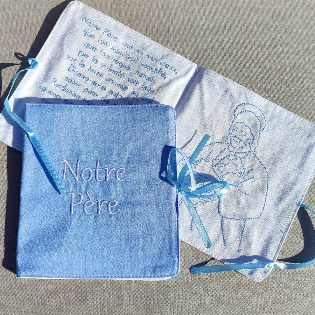 Livre en tissu Notre Père - bleu